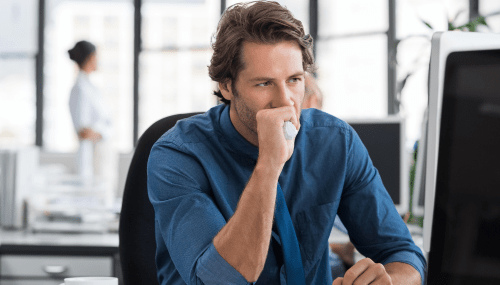 CISO nightmares blog featured image man looking stressed and focused at desk